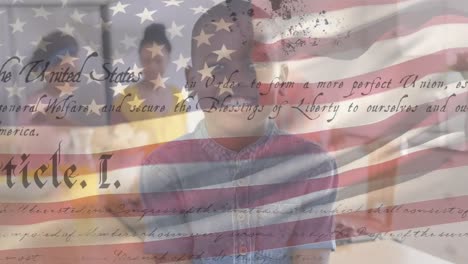 African-American-child-smiling-with-US-flag-waving-and-constitution-foreground