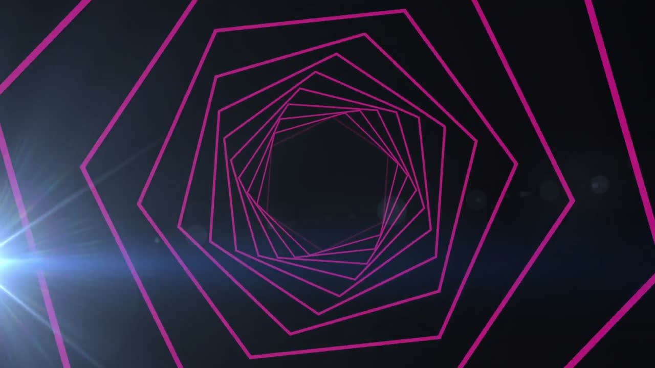 formas hexagonales que giran en movimiento sin costuras contra un punto de luz sobre un fondo negro