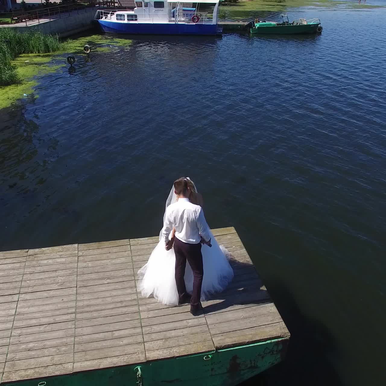 Bride And Groom On The Pier