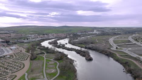 "tormes" river next to the city of salamanca in spain, aerial drone view