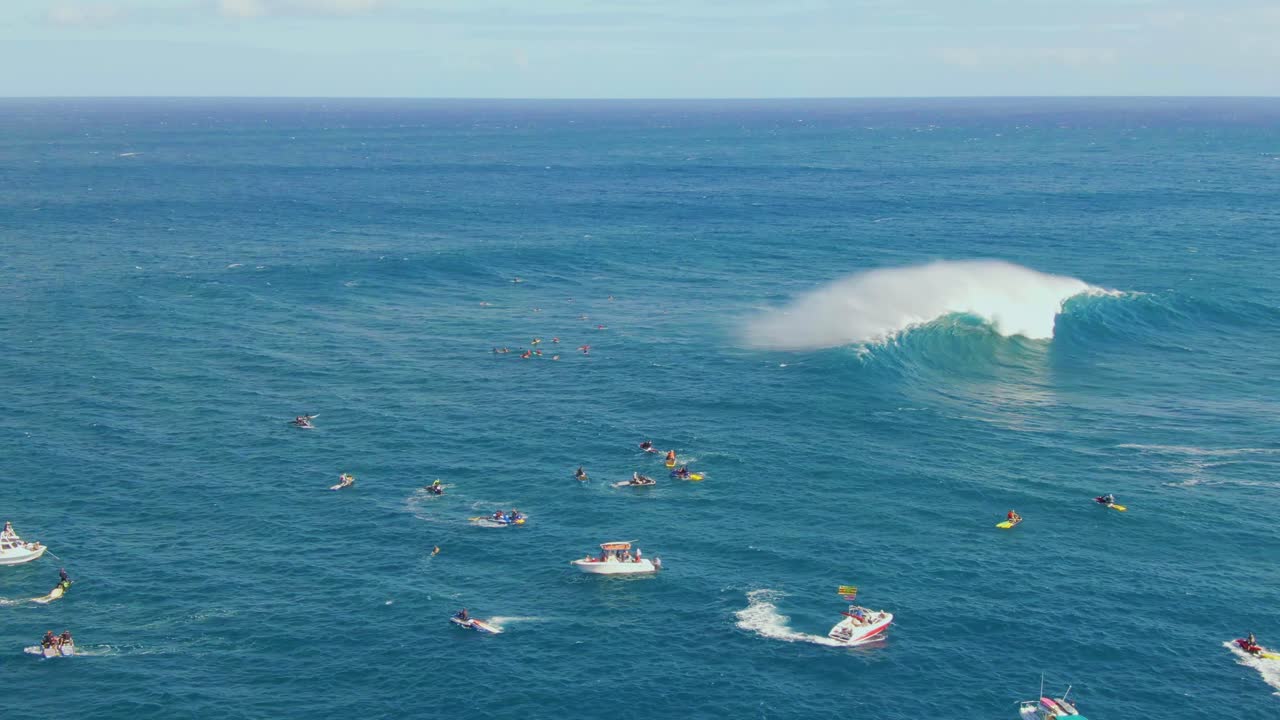 Courageous young surfers paddle close to big ocean waves trying to find right moment for riding wave in Hawaii