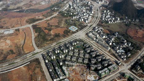 Yangshuo-city-residential-buildings-construction-site-in-China,-aerial-view