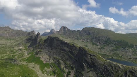 aerial view of a mountain range with a lake