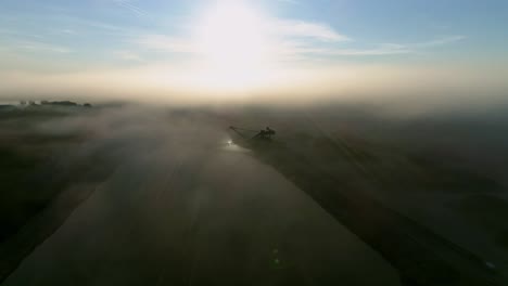 Beautiful-footage-of-a-pond-and-an-excavator-hidden-in-fog