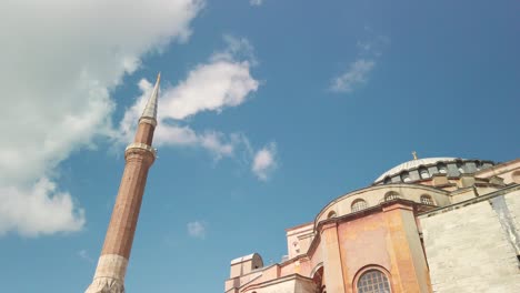 Daytime,-under-partly-cloudy-skies,-cinematic-slow-mo,-an-upward-view-of-Hagia-Sophia-Mosque-from-below