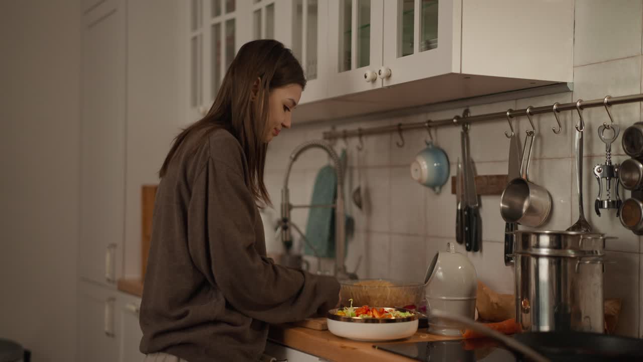 Woman cooking a meal in the kitchen