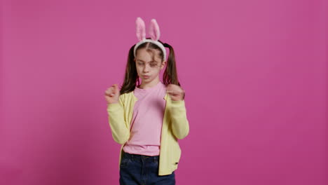 confident cheery girl showing dance moves in the studio