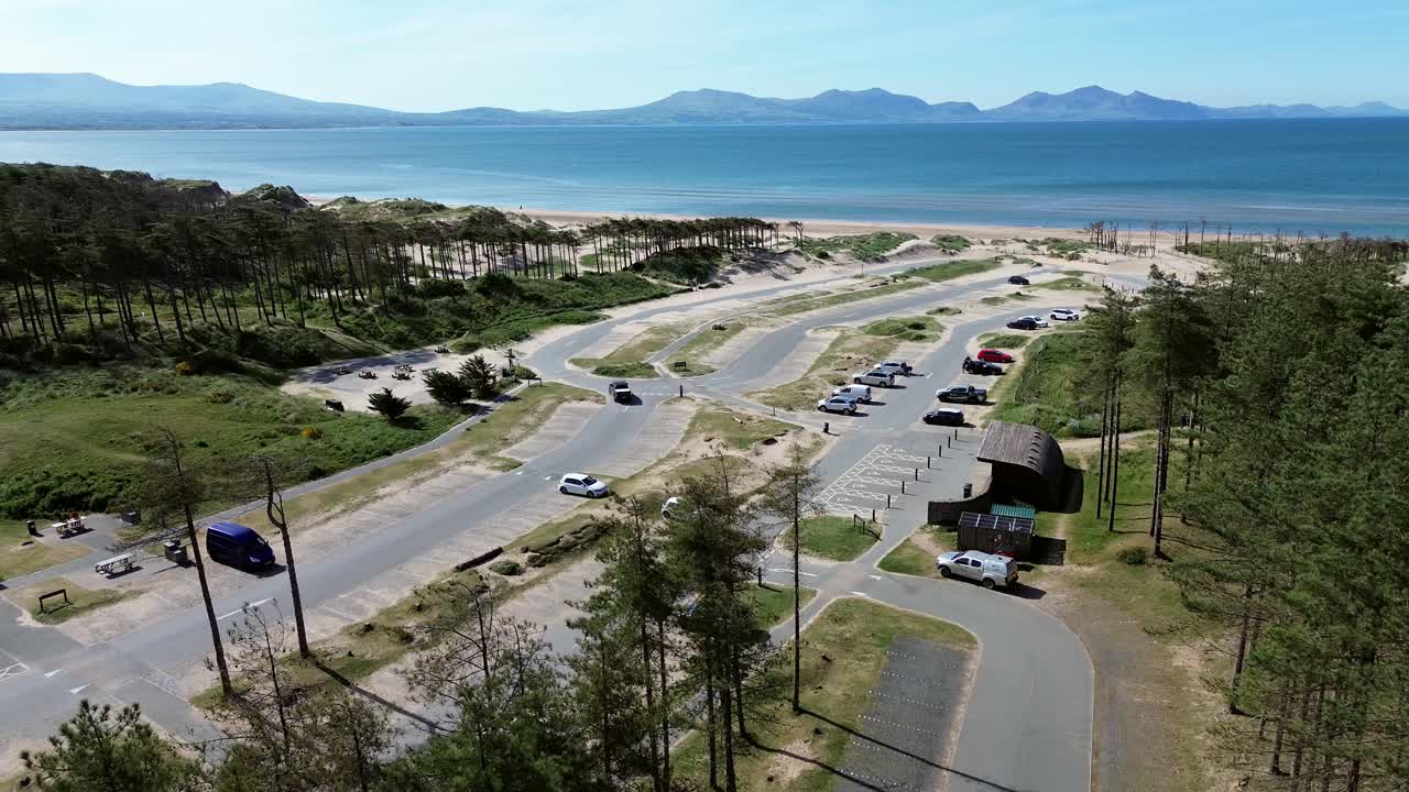 Newborough forest beach car park aerial view overlooking stunning Snowdonia mountain range