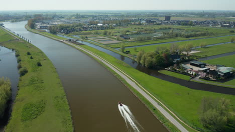 speedboat navigating on gouwekanaal in gouda, netherlands