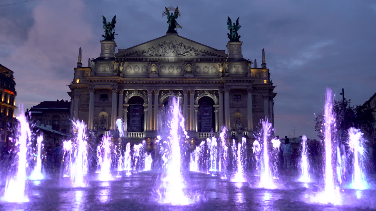 Lviv Opera House at Night with Illuminated Fountains