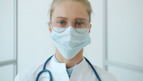 female doctor wearing mask and glasses