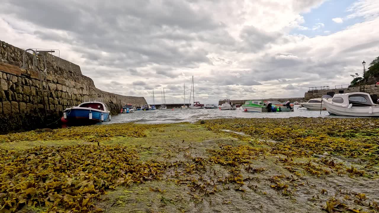 Boat moving towards pier in Fife, Scotland