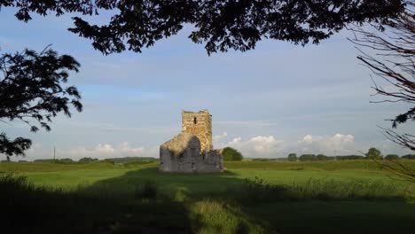 knowlton church, dorset, england. early morning light