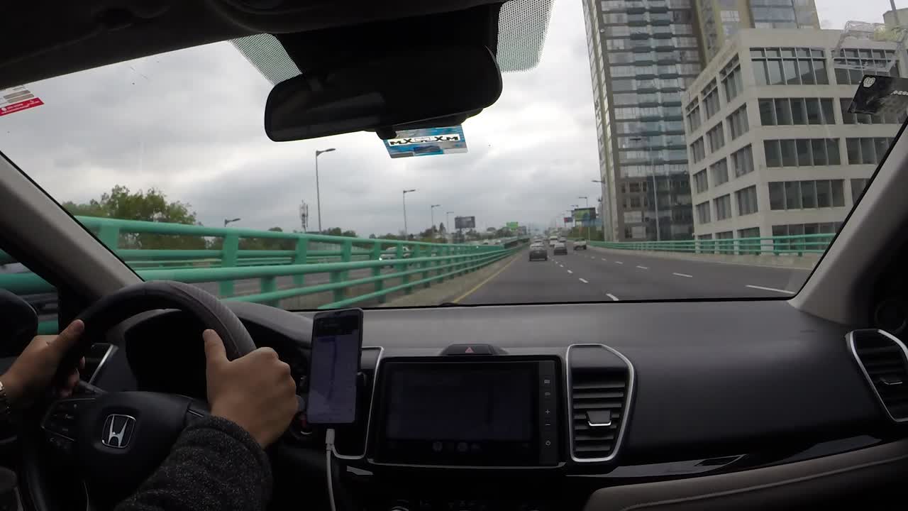 Car driving through the streets of Periferico Sur, Mexico City. Time lapse