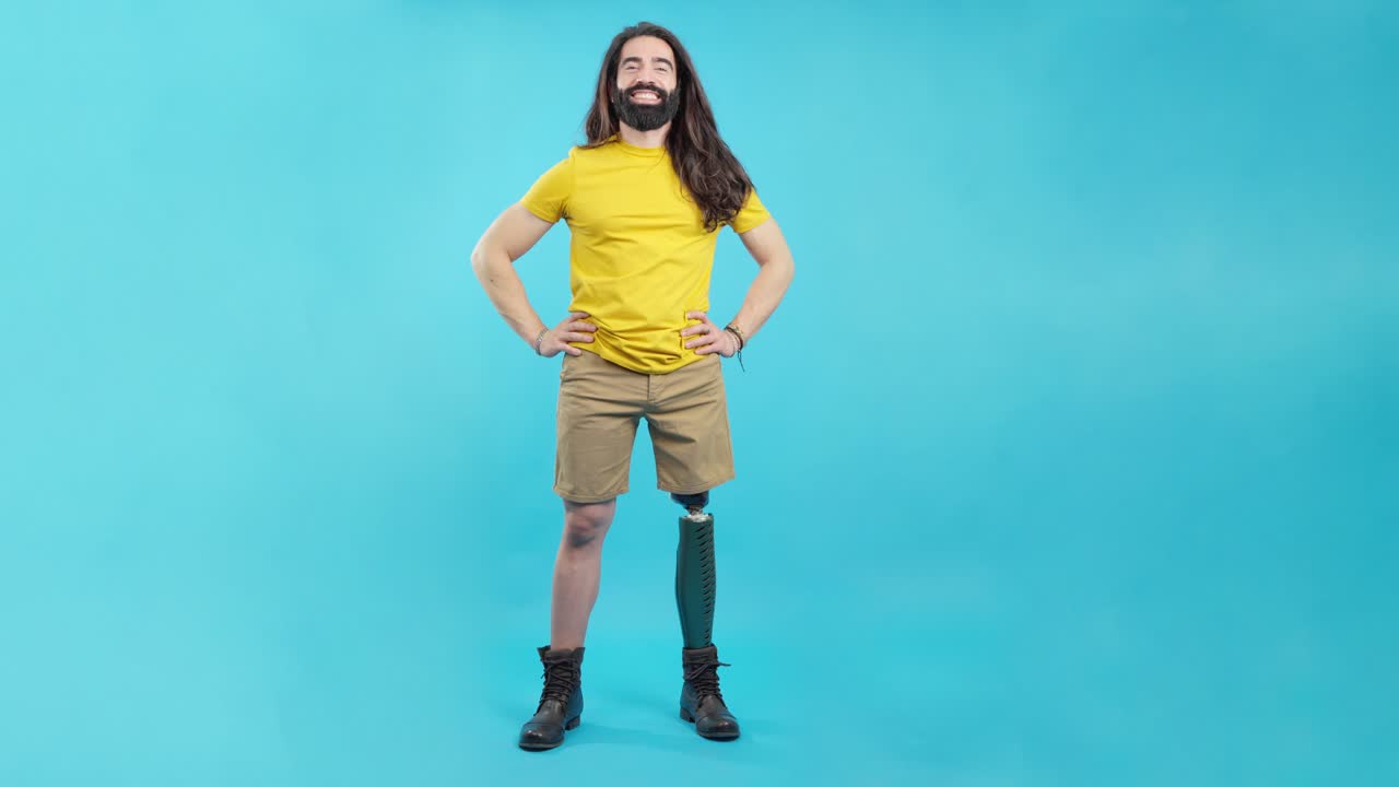Happy man with a prosthetic leg and long hair smiling confidently