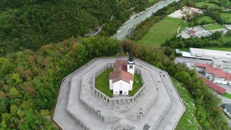 Aerial-drone-shot-of-a-church-in-Slovenia,-tilting-down-the-camera,-4k-UHD