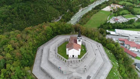 aerial drone shot of a church in slovenia, tilting down the camera, 4k uhd