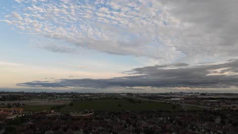 Wide-Time-Lapse-shot-neighborhood-in-Toronto-area,-Clouds-moving-fast---Canada