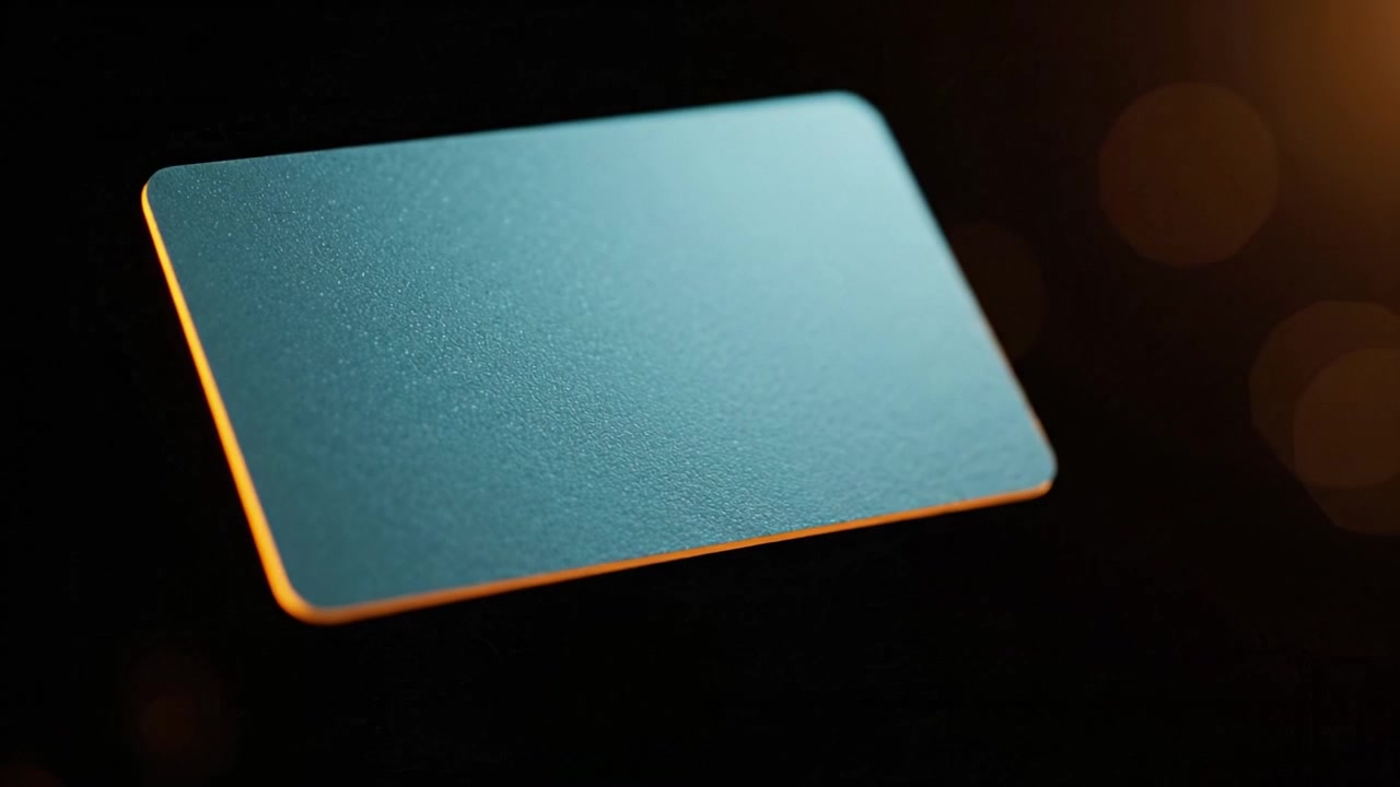 A Close-Up View of a Glossy Surface on an Abstract Card Against a Dark Background with Soft Bokeh Lights, Highlighting Its Smooth and Reflective Features.