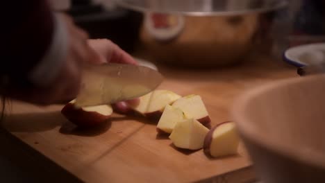 at home chopping up some apples for breakfast