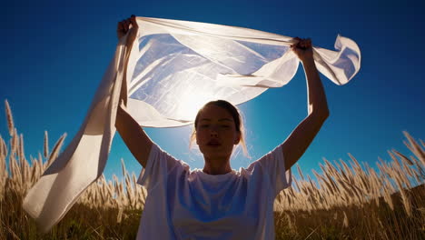 woman in a field with a cloth