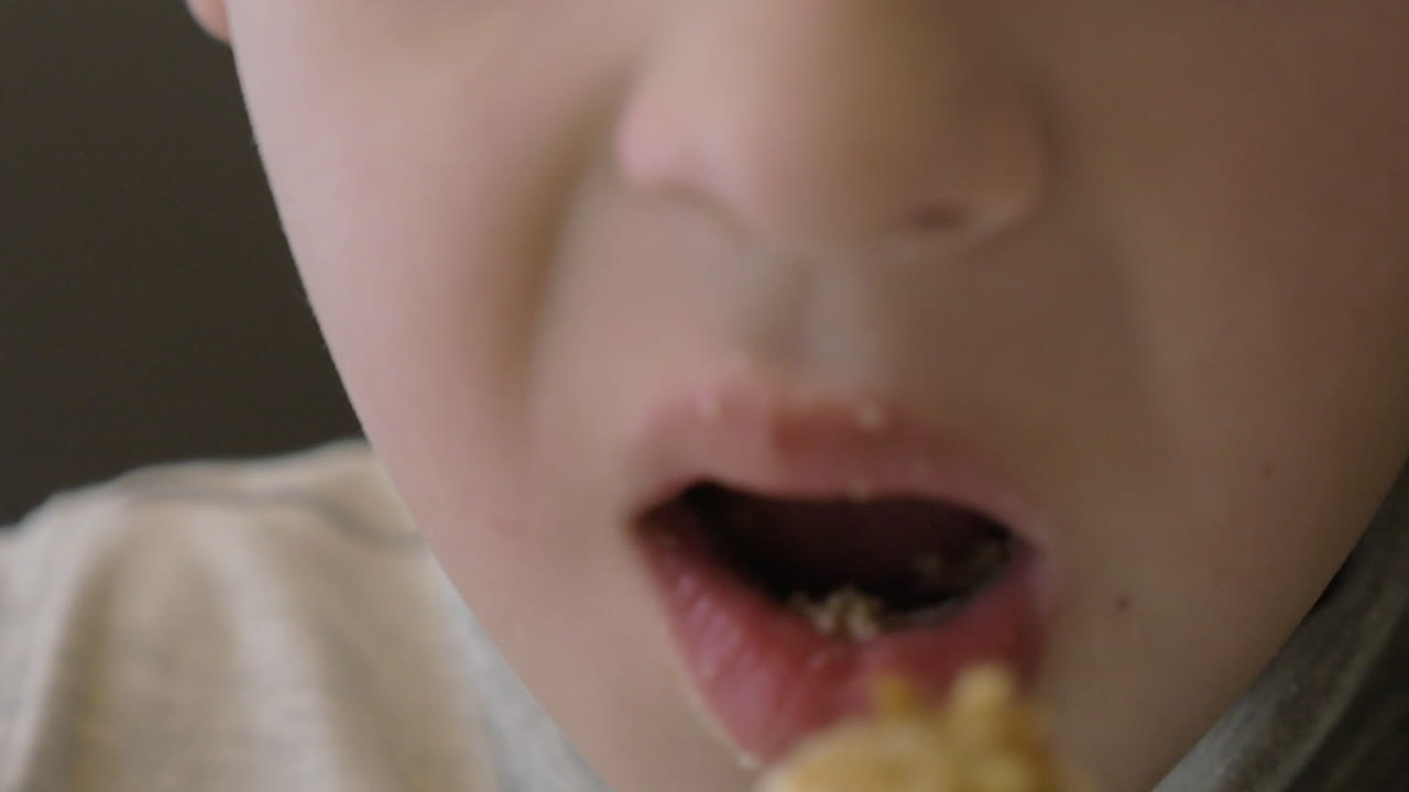 Feeding a kid with spoon