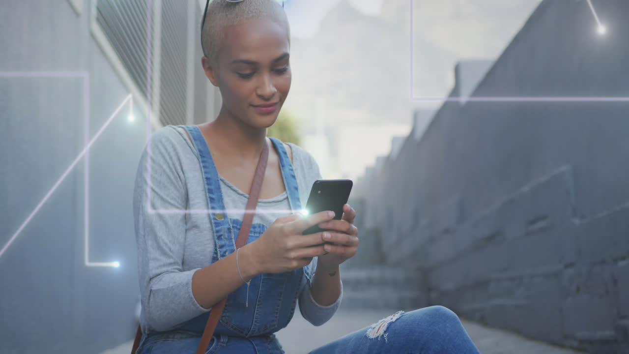 Animation of light trails over biracial woman using smartphone