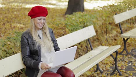 woman using video chat app on laptop