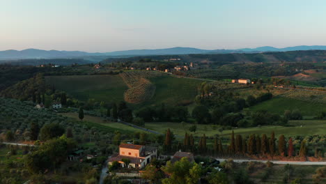 aerial view of the green rolling hills of tuscany italy at sunrise