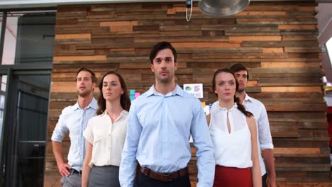 group of business executives walking in office