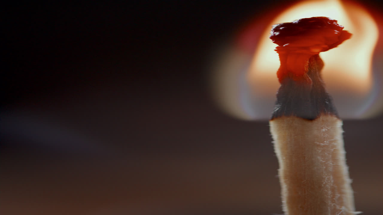 Vertical Close Up of Matchstick Burning with Warm Flame