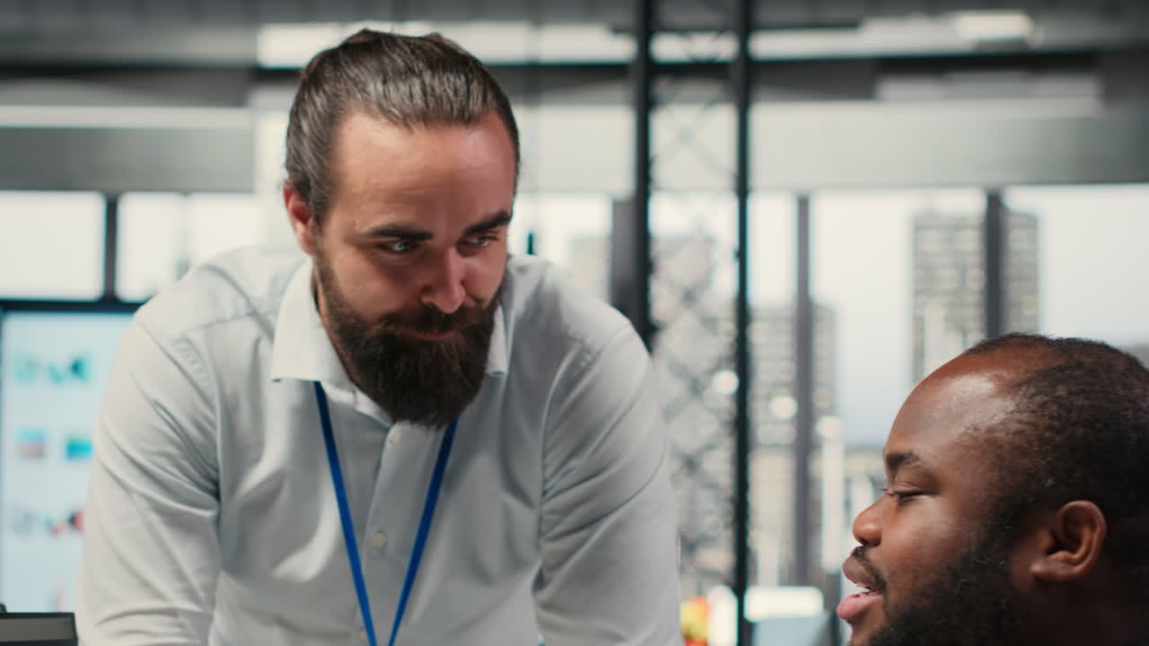 Vertical Video Diverse corporate team focuses on data management on computer