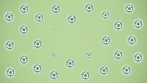 animation of multiple falling recycling text and logos, and trees in lightbulbs on green