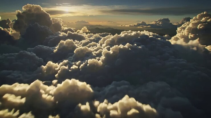 Pilot moving drone through cumulus clouds, low sun lighting rims, revealing depth for aviation