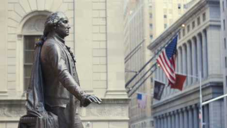 the statue of george washington on wall st in the financial district of manhattan in new york city