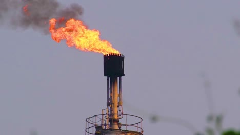 A-towering-gas-refinery-structure-spews-fiery-flames-into-the-atmosphere