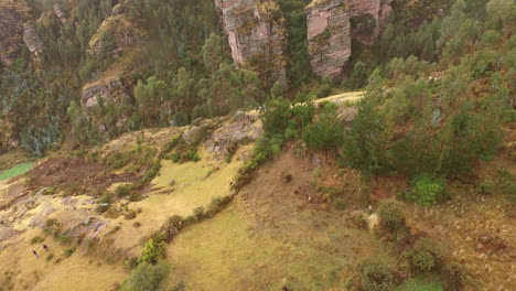 Aerial-tilting-shot-showing-a-group-of-hikers-in-a-jungle-in-south-America