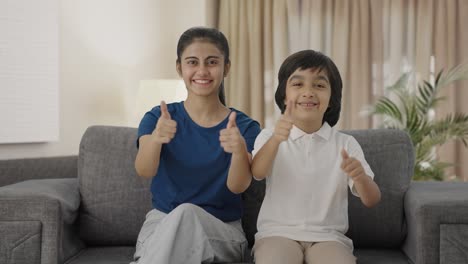 Happy-Indian-siblings-showing-thumbs-up-to-the-camera