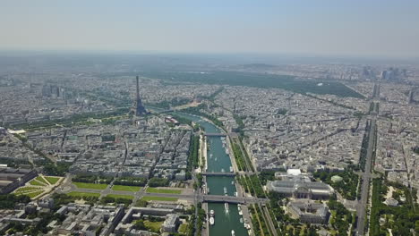 Aerial-panoramic-footage-of-large-city.-Historic-centre-with-landmarks,-modern-business-borough-and-various-town-development.-Paris,-France