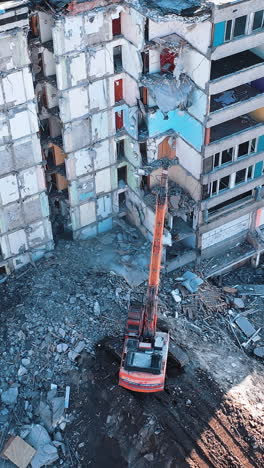 special machinery destroys old buildings. destruction of a building with special machine