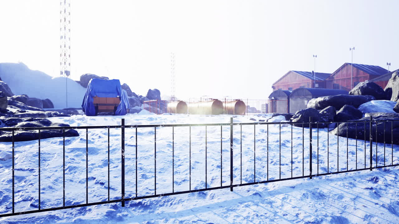 Bright winter day at a remote research station surrounded by snow and ice