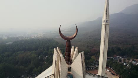 close-up drone tilt shot of the high faisal mosque in islamabad at daylight