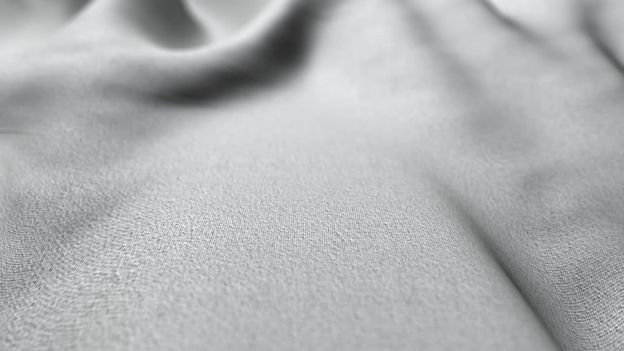 Increspature di tessuto bianco che formano una rilassante texture di movimento astratto.