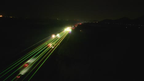 Aerial-of-laser-display-in-the-sky-over-the-Qingdao-Yinchuan-Expressway-near-Zibo,-China,-strategically-employed-to-deter-drivers-from-experiencing-drowsiness-on-the-highways-of-China