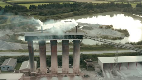 Flying-over-smoking-factory-buildings