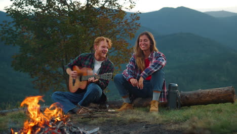 Two-campers-rest-outdoors-in-mountains.-Happy-couple-spend-vacation-closeup.