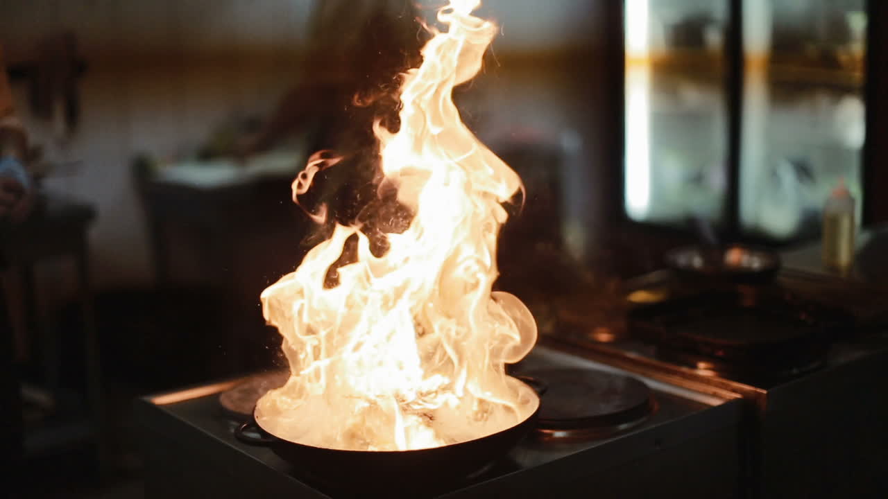 Professional Kitchen, Preparing Dinner. Restaurant kitchen with stove with pan, preparing dinner