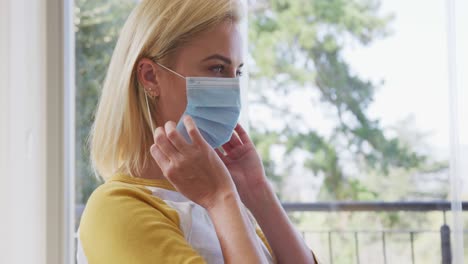 Woman-wearing-face-mask-at-home