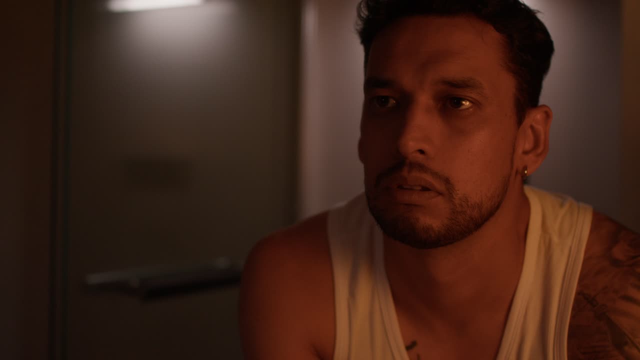 Portrait of a man with a beard and tattoo