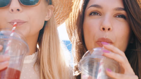 two women enjoying drinks outdoors